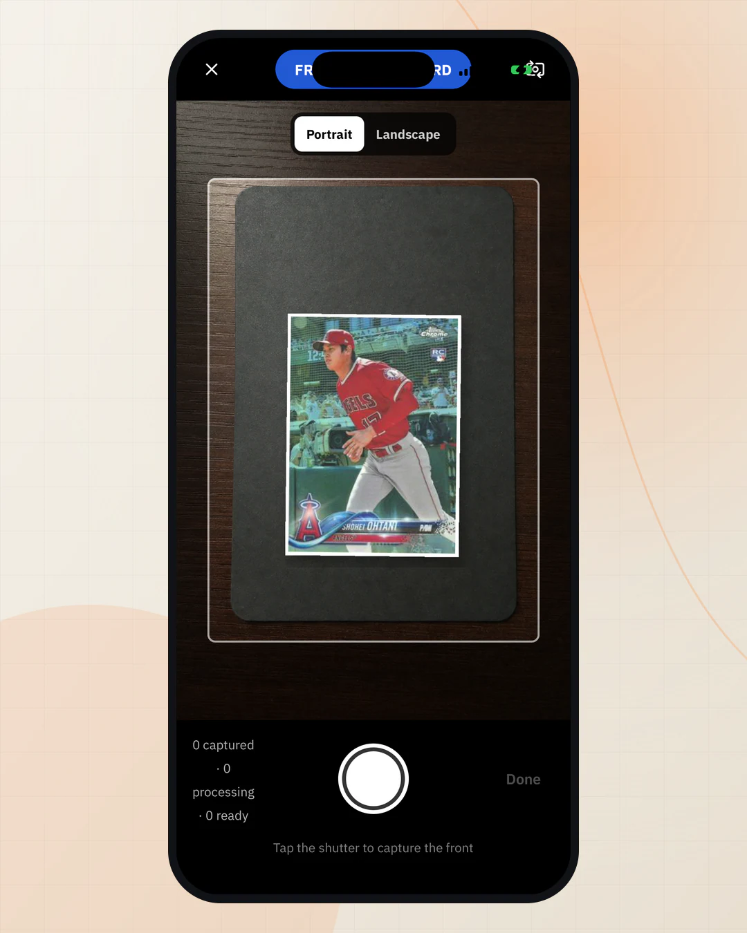 RocketVault's native iPhone camera framing an exact 2018 Topps Chrome Shohei Ohtani rookie card on a dark scan mat.